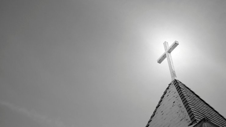 An old rural church steeple in black and white with copy space