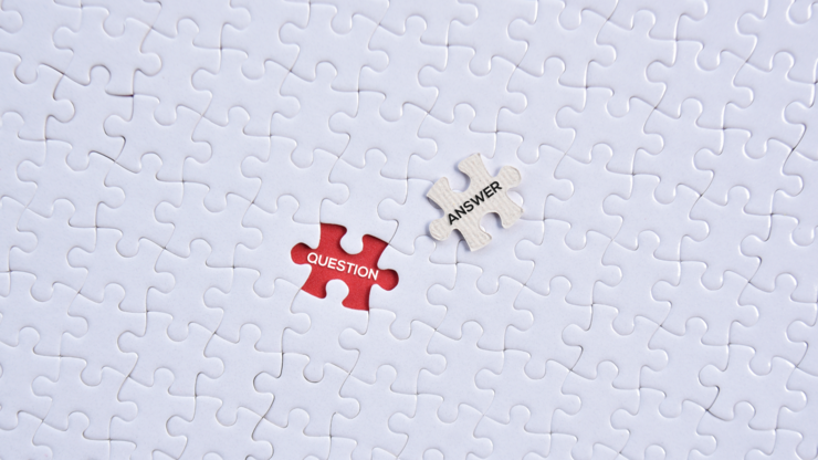 'Question and answer' word on white puzzles with red background flat lay concept.