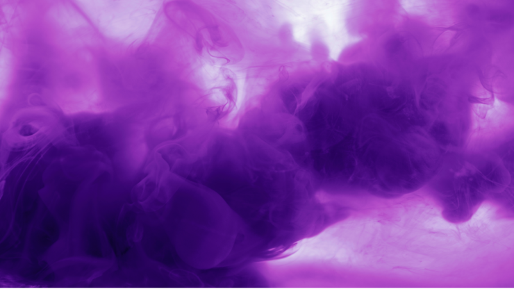 Purple ink swirls in water, creating soft, cloudy patterns against a white background.