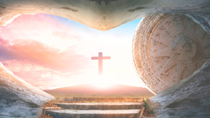 Easter concept: Empty Tomb Of Jesus Christ At Sunrise With  Cross background