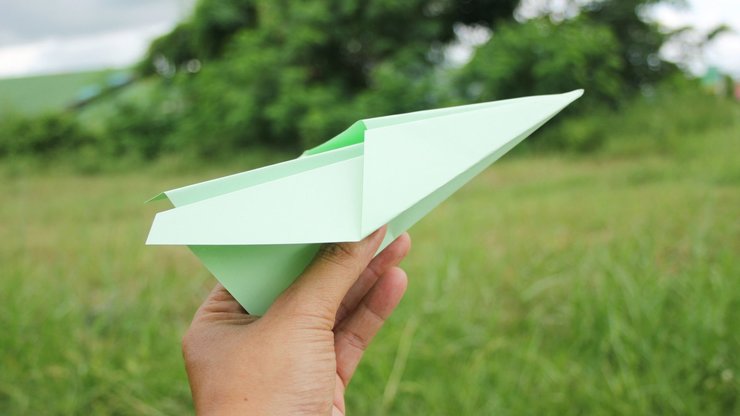 Green paper aeroplane - Green travel concept